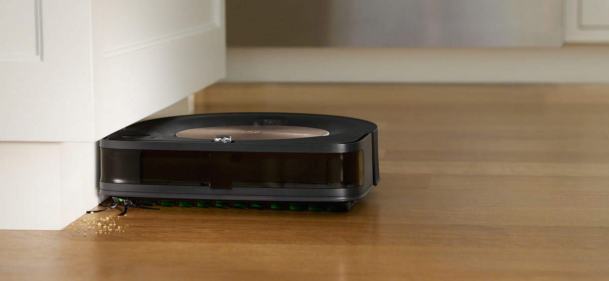 iRobot's Roomba s9 cleaning against the cabinet