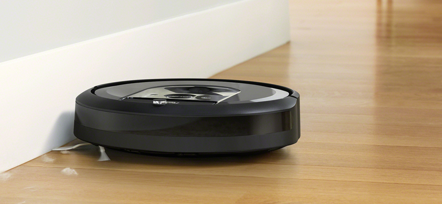 iRobot's Roomba i7 cleaning against the cabinet